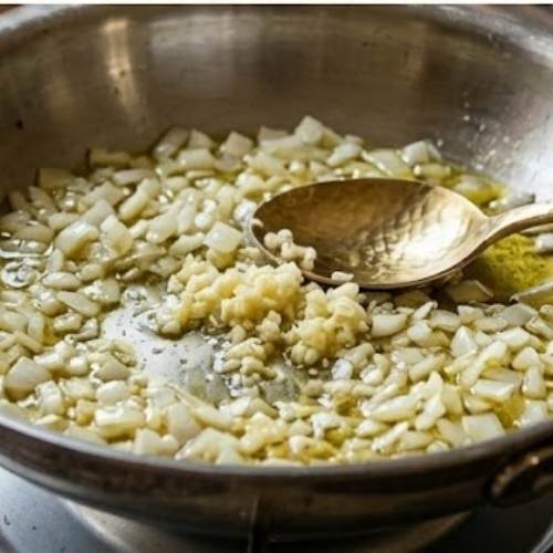 Step 6: Sauté the Onions and Garlic